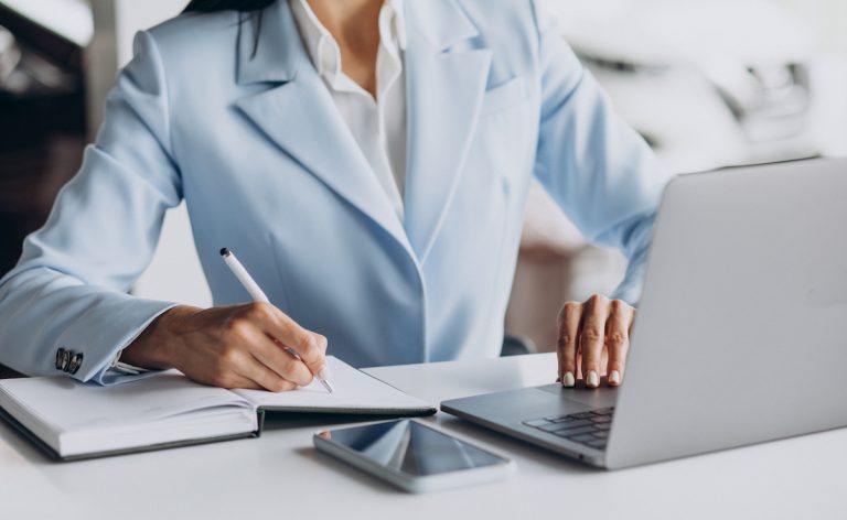 Business woman working in office on computer